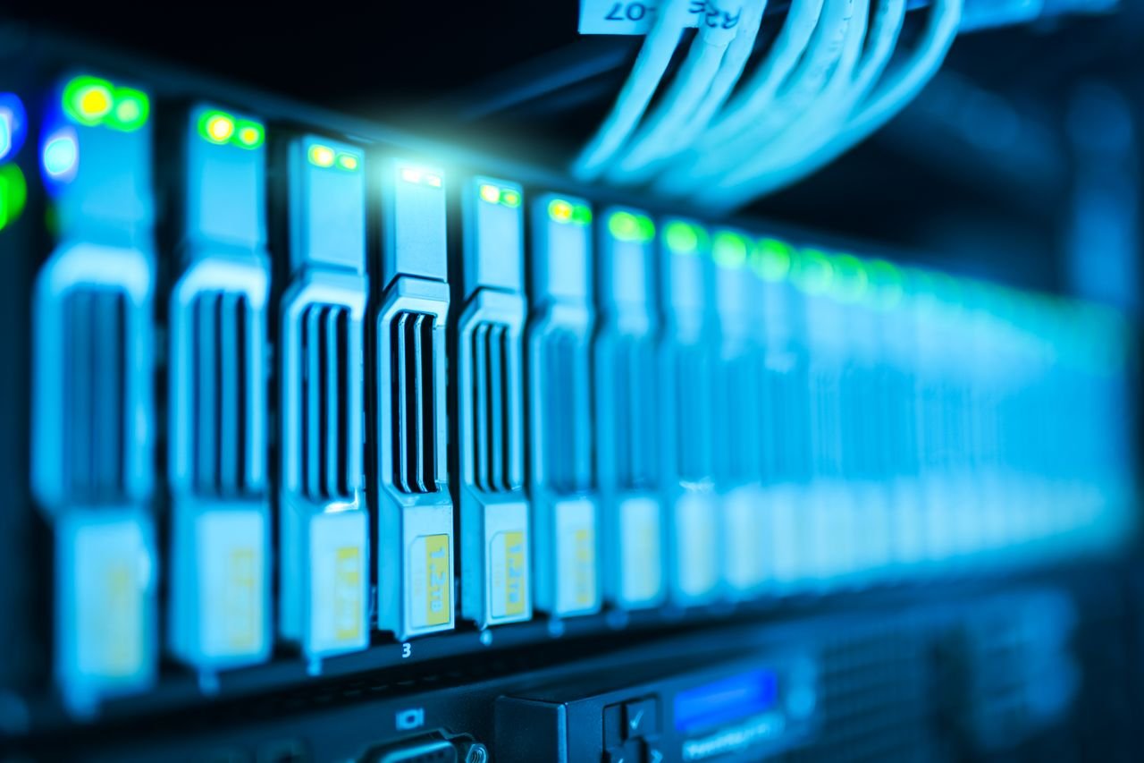Close-up of illuminated server rack drives in a data center