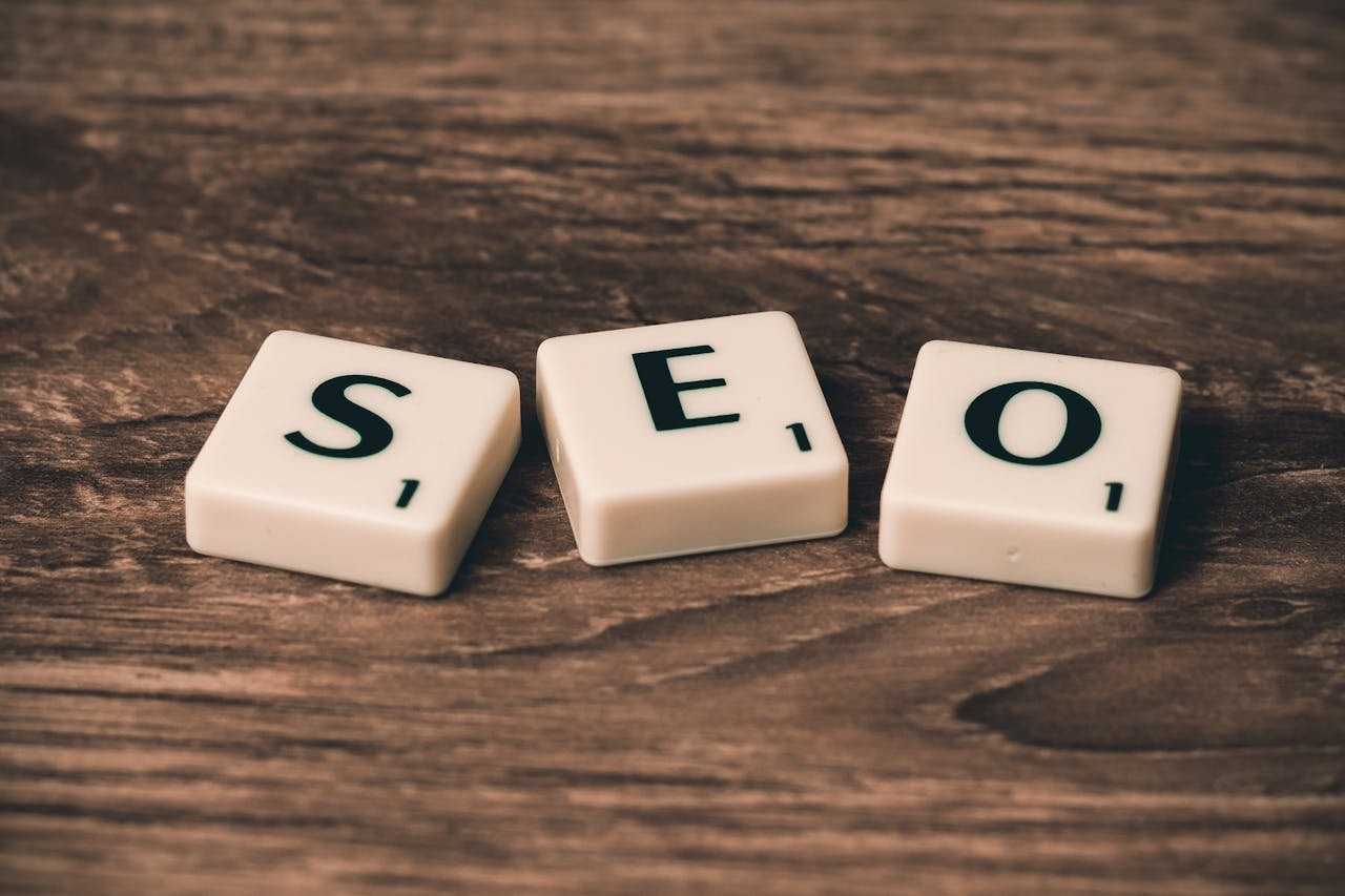 WordPress dashboard open on a laptop showing SEO plugin settings and analytics